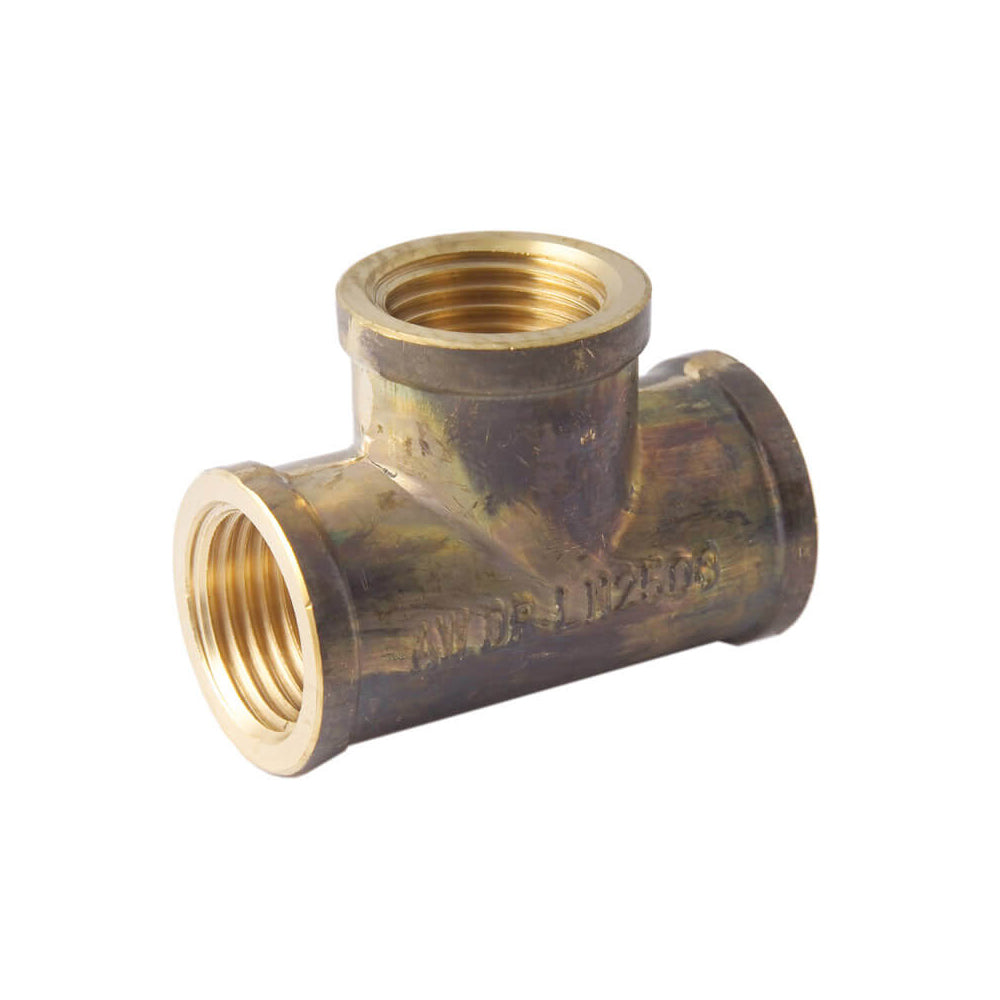 Brass T-fitting on a white background