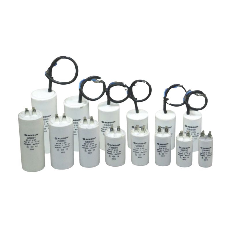 Row of white cylindrical capacitors with black leads on a white background