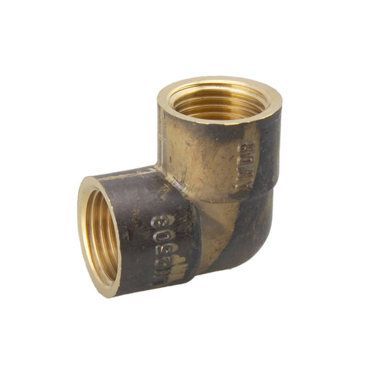 Brass elbow pipe fitting on a white background